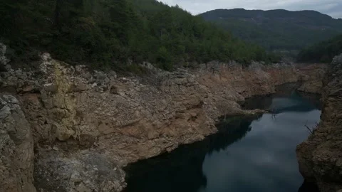Aerial view of the mirror water surface in the canyon 動画素材 231024375