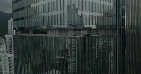 Aerial view of the mirrored window skyscraper in Hong Kong city Stock Footage 103469931
