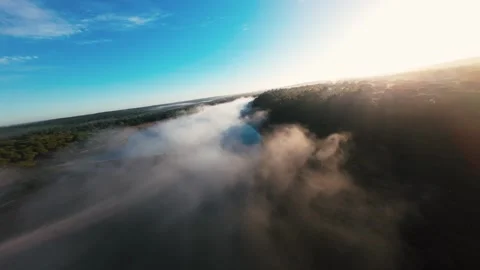 Aerial view of mist moving over forested land Stock Footage 340903992