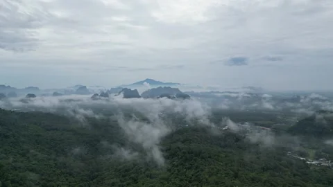 Aerial View of Misty Clouds Over Green Tropical Forest in Ao Nang, Krabi, Stock Footage 334776730