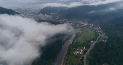 Aerial view: Misty forest, Flying through the clouds in Transcarpathian city Stock Footage 95876734