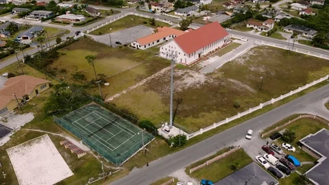 Aerial View of Mobile Cell Tower at Columbus Park, Grand Bahama, Bahamas Stock Footage 106159352
