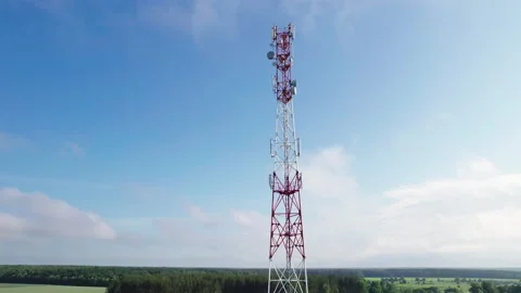 Aerial view of a mobile communication tower against the background of floating Stock Footage 161217253