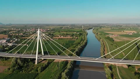 Aerial view of a modern bridge over a river in northern Italy. Stock Footage 132859634