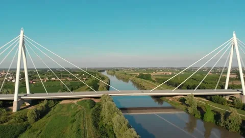 Aerial view of a modern bridge over a river in northern Italy. Stock Footage 132859679