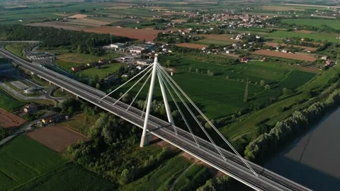 Aerial view of a modern bridge over a river in northern Italy. Stock Footage 132859721