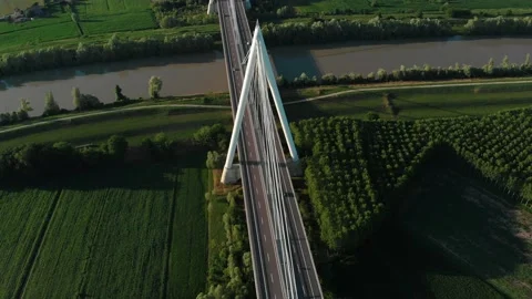 Aerial view of a modern bridge over a river in northern Italy. Stock Footage 132859753
