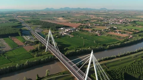 Aerial view of a modern bridge over a river in northern Italy. Stock Footage 132859868
