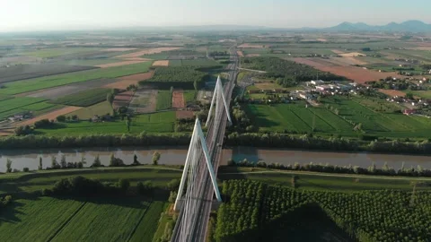 Aerial view of a modern bridge over a river in northern Italy. Stock Footage 132859897