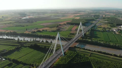 Aerial view of a modern bridge over a river in northern Italy. Stock Footage 132859904