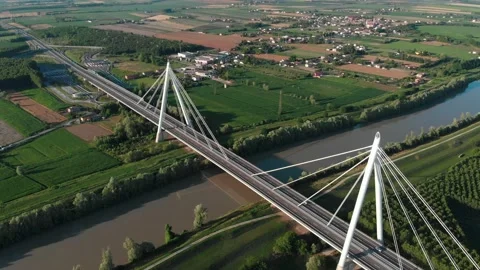 Aerial view of a modern bridge over a river in northern Italy. Stock Footage 132859924