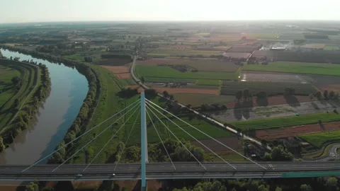 Aerial view of a modern bridge over a river in northern Italy. Stock Footage 132860140