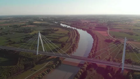 Aerial view of a modern bridge over a river in northern Italy. Stock Footage 132860157