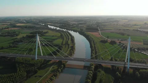 Aerial view of a modern bridge over a river in northern Italy. Stock Footage 132860334