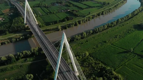 Aerial view of a modern bridge over a river in northern Italy. Stock Footage 132860342