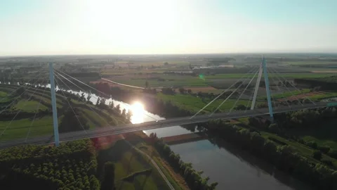 Aerial view of a modern bridge over a river in northern Italy. Stock Footage 132860497
