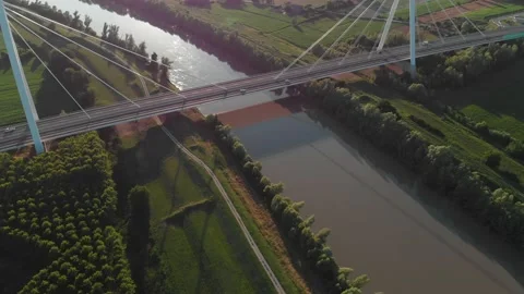 Aerial view of a modern bridge over a river in northern Italy. Stock Footage 132860523