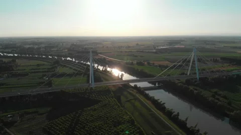 Aerial view of a modern bridge over a river in northern Italy. Stock Footage 132860728