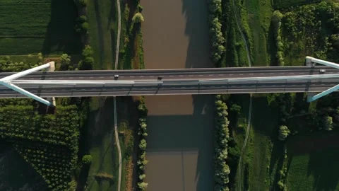Aerial view of a modern bridge over a river in northern Italy. Stock Footage 132860984