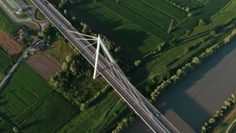 Aerial view of a modern bridge over a river in northern Italy. Stock Footage 132861123