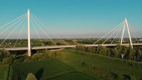 Aerial view of a modern bridge over a river in northern Italy. Stock Footage 132861500