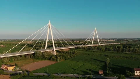Aerial view of a modern bridge over a river in northern Italy. Stock Footage 132861661