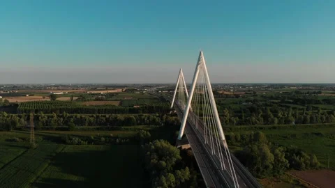 Aerial view of a modern bridge over a river in northern Italy. Stock Footage 132861718