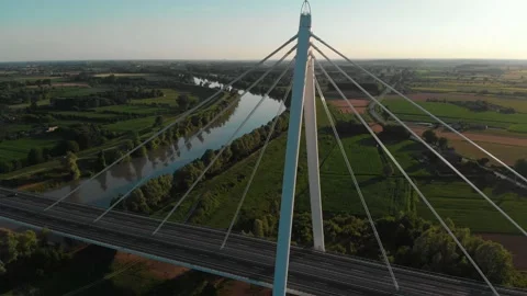 Aerial view of a modern bridge over a river in northern Italy. Stock Footage 132861875