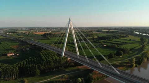 Aerial view of a modern bridge over a river in northern Italy. Stock Footage 132862020