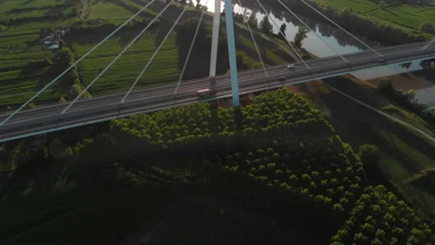 Aerial view of a modern bridge over a river in northern Italy. Stock Footage 132862170