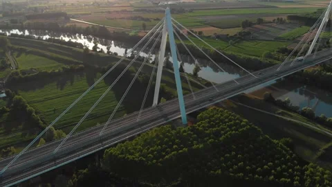 Aerial view of a modern bridge over a river in northern Italy. Stock Footage 132862266