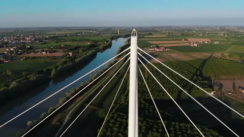 Aerial view of a modern bridge over a river in northern Italy. Stock Footage 132862362