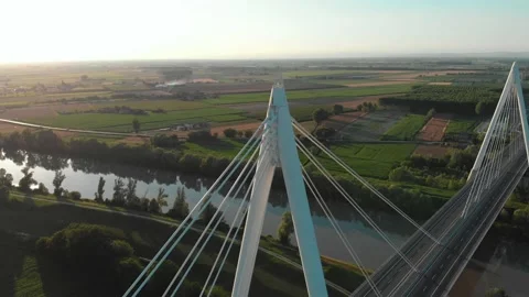 Aerial view of a modern bridge over a river in northern Italy. Stock Footage 132862434