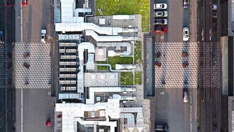 Aerial view of modern building rooftop showcasing intricate ventilation systems Stock Footage 341396921