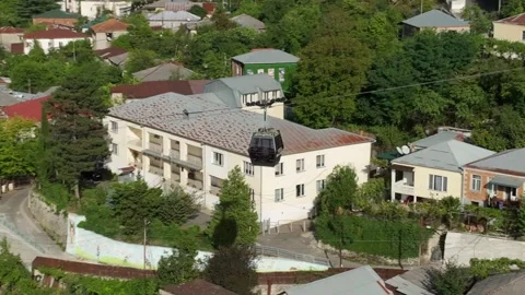Aerial view of the modern cable car in Chiatura miners city, Georgia Видео 219337646