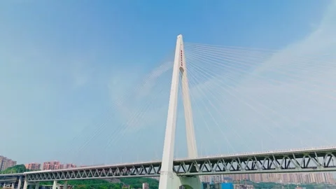 Aerial view of a modern cable-stayed bridge over a wide river Stock Footage 330589278