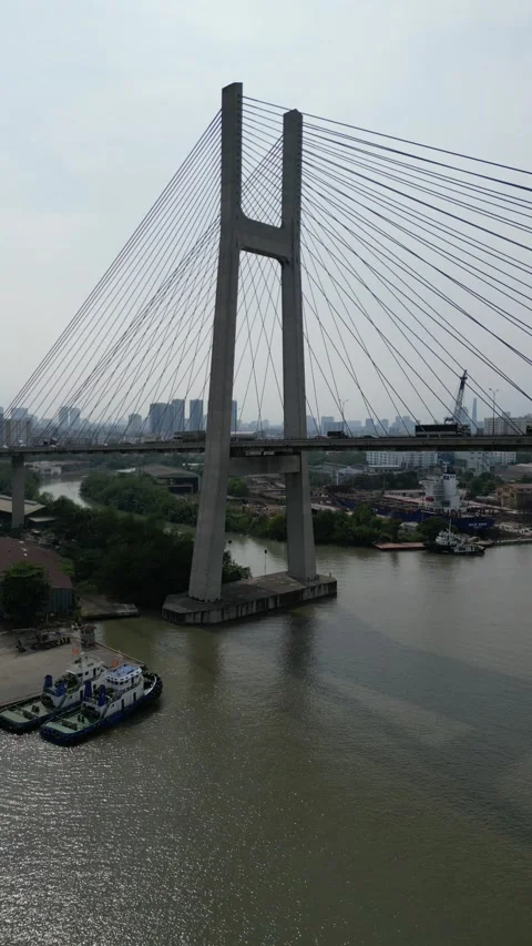 Aerial View of Modern Cable Stayed Bridge Over River in Ho Chi Minh City, Stock Footage 335576862