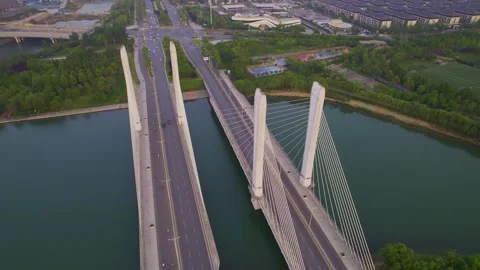 Aerial View of Modern Cable Stayed Bridge Over River with Traffic Video stock 337420901