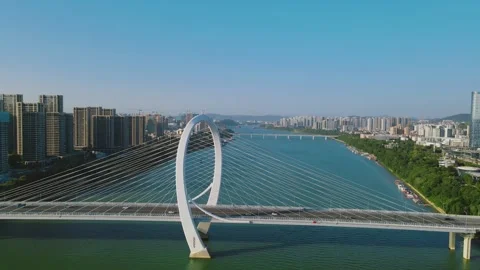 Aerial view of a modern cable stayed bridge crossing a wide river in city Video stock 347056068