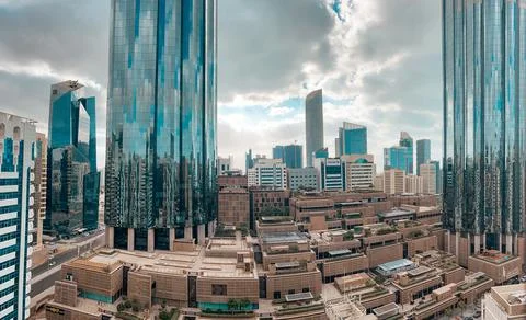 Aerial view of a modern city with clouds - Downtown Abu Dhabi landmarks Stock Photos