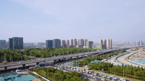 Aerial View of Modern City with Elevated Highway and Construction Sites Stockbeeldmateriaal 335150022