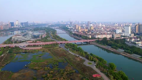 Aerial view of modern cityscape along river in midtown of jinhua Stock Footage 197342953