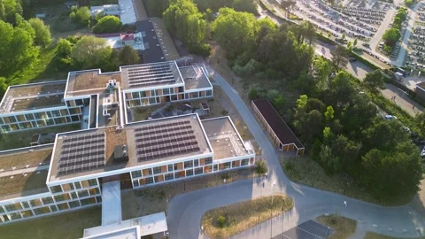 Aerial view of a modern complex with flat-roofed buildings, solar panels Stock-Footage 316896893