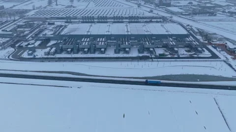 Aerial view of a modern data center covered in snow during winter Stock Footage 327904452