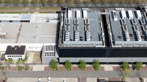 Aerial view of a modern data center building rooftop with hvac units Stock Footage 333823416