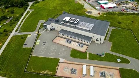Aerial View of Modern Data Center With Renewable Cooling Systems on Rooftop Stock Footage 334699467