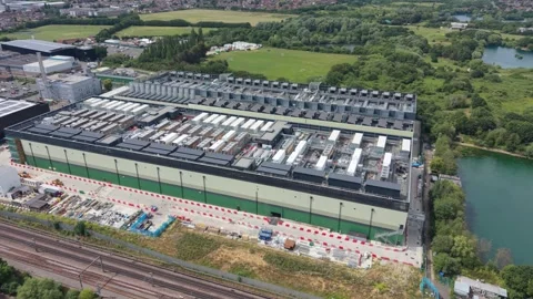 Aerial View of Modern Data Center Complex by Rail Tracks and Lake Stock Footage 339645411