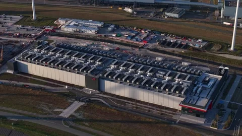 Aerial view of a modern data center with renewable energy wind turbines Stock Footage 344768379