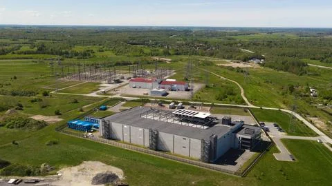 Aerial view modern data center and electrical substation linking energy 스톡 사진