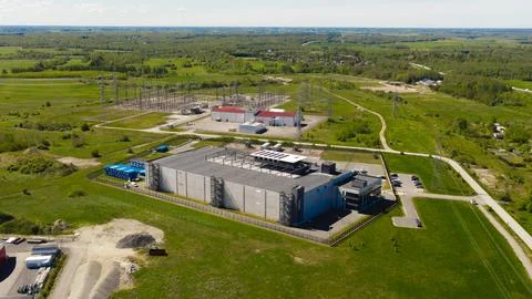 Aerial view modern data center building next to power substation Stock Photos